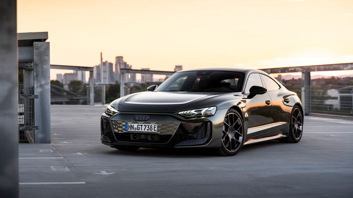 The Audi RS e-tron GT performance on a park deck infront of a sunrise