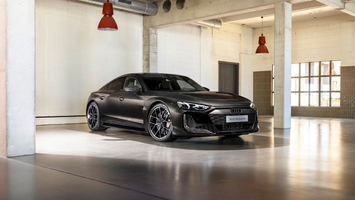 The Audi RS e-tron GT performance stands in a car park