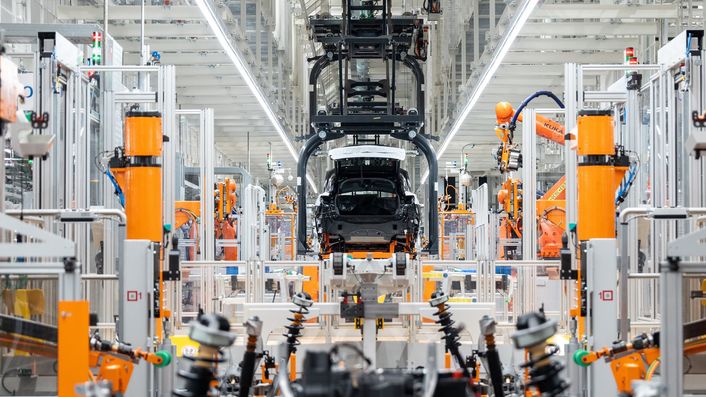 State-of-the-art vehicle assembly in production with robotic arms