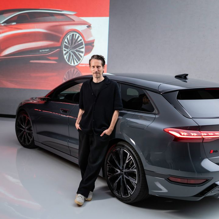 Sascha Heyde leans against an Audi A6 Avant e-tron